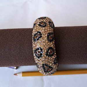 Leopard pattern crystal gold hinged bracelet.